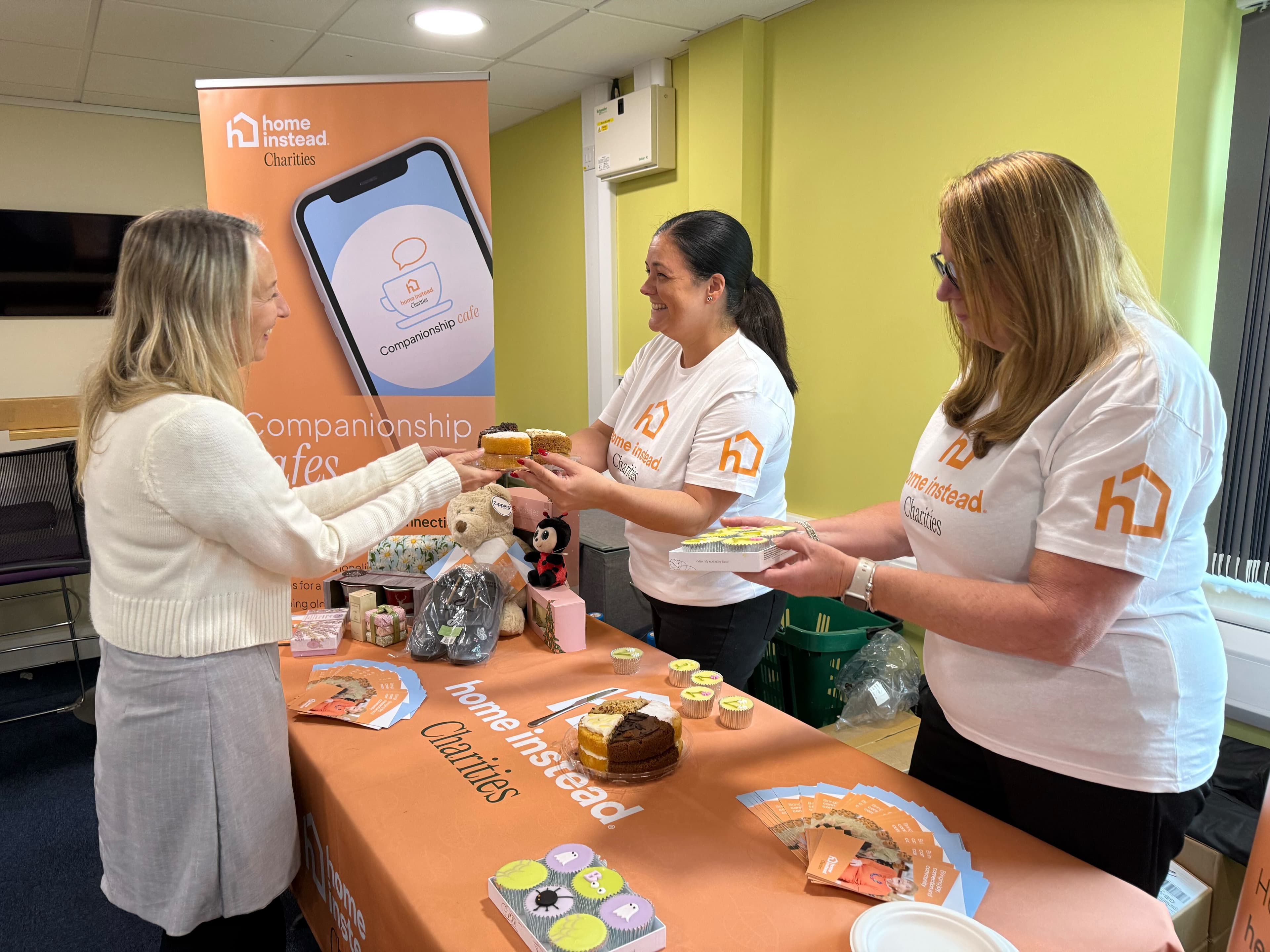 group of women at a charity bake stall